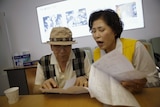 A South Korean man gets documents prepared