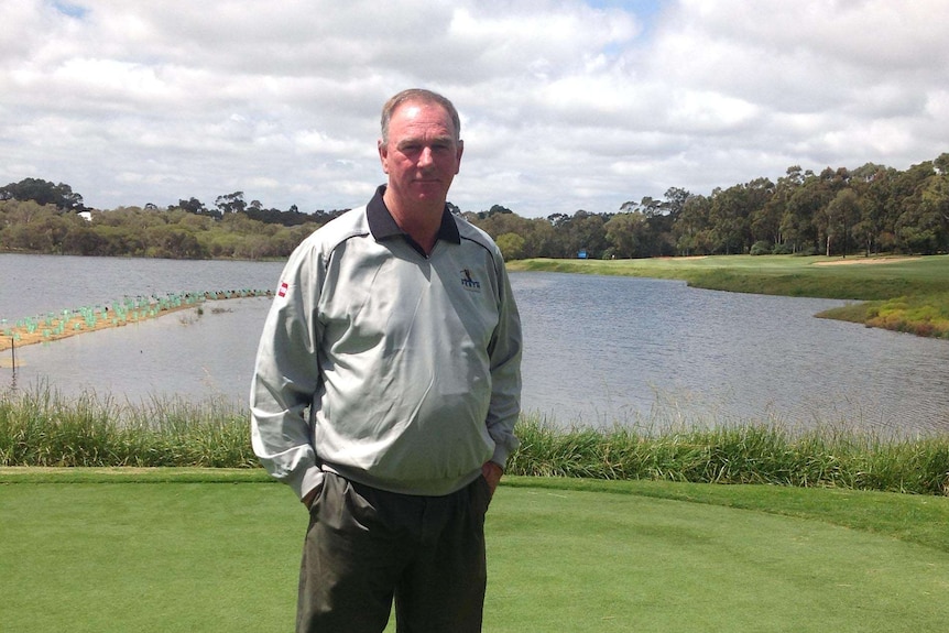 Course superintendent Trevor Strachan on the green in front of the lake at Lake Karrinyup golf course