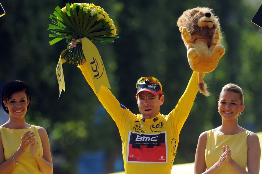 Australia's overall winner Cadel Evans celebrates on the podium on the famous Champs-Elysees.