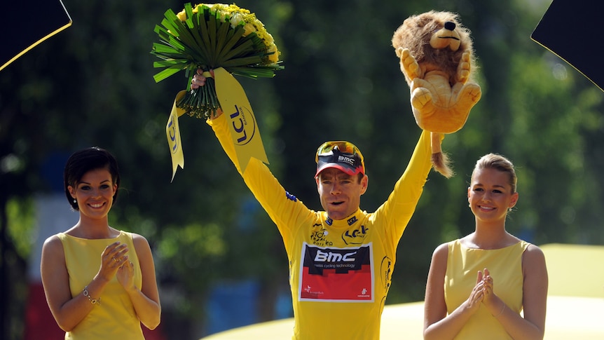Australia's overall winner Cadel Evans celebrates on the podium on the famous Champs-Elysees.
