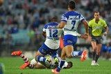 Bulldogs' Frank Pritchard comes in with his knees on the Dragons' Gareth Widdop.