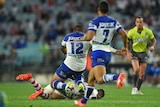 The Bulldogs' Frank Pritchard comes in late with his knees on the Dragons' Gareth Widdop
