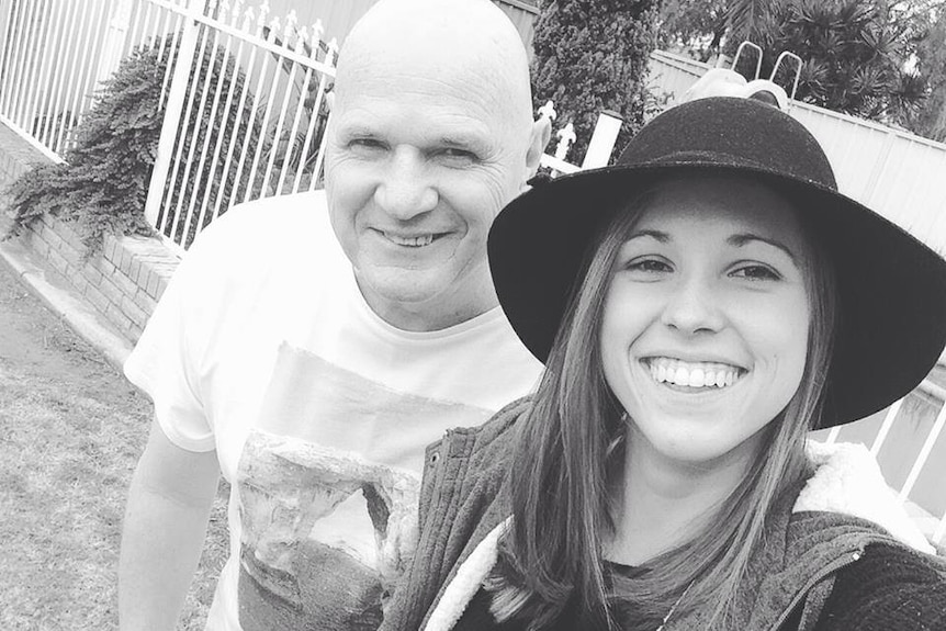 Paige Hadley and her dad Michael smile for a selfie.