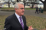 Denison Independent MP Andrew Wilkie speaks to reporters in Hobart after the 2016 federal election.