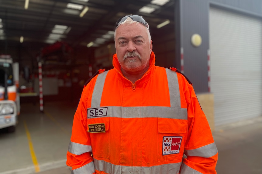 A man wearing SES uniform.