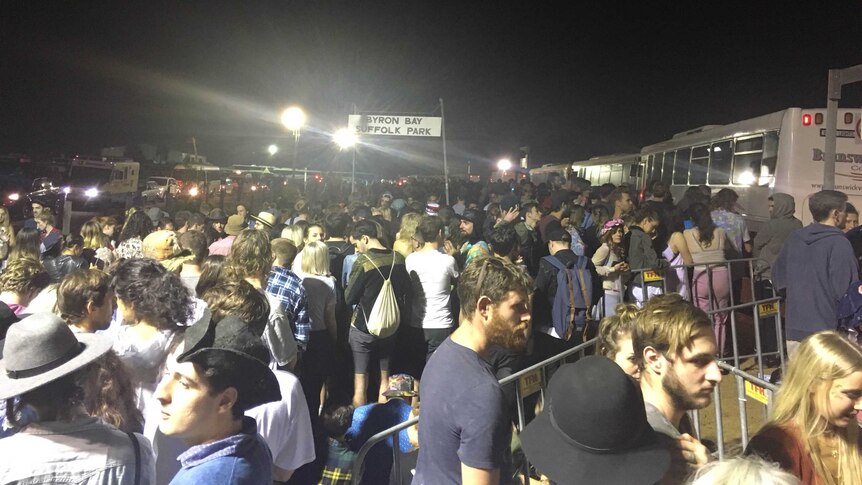 Crowds wait for buses after night one of Splendour in the Grass