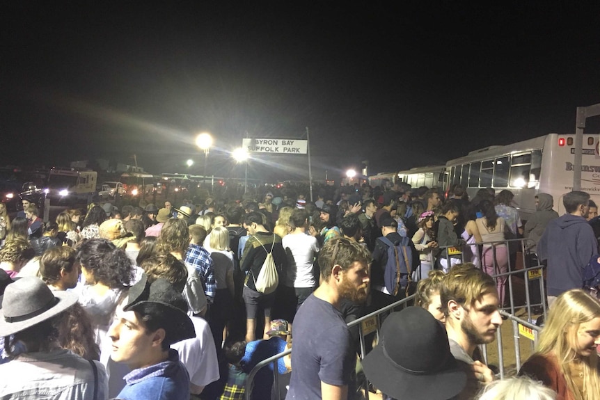 Crowds wait for buses after night one of Splendour in the Grass