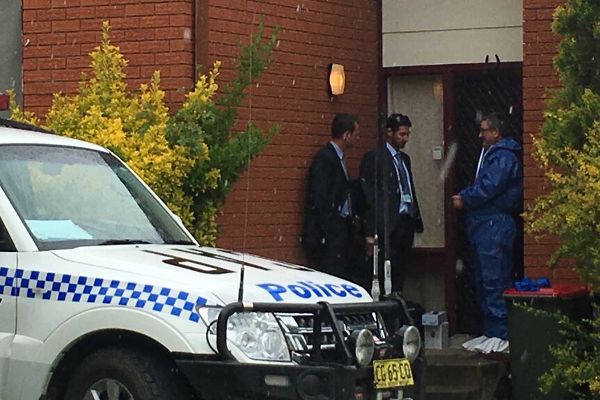 Crime scene investigators standing outside Lithgow home where 11 month old girl injured