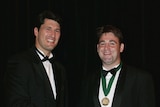David Lyons (right) receives John Eales medal from Eales.