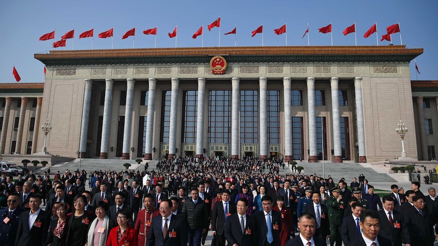 Delegates leave the Great Hall of the People after attending a meeting of the NPC in China.