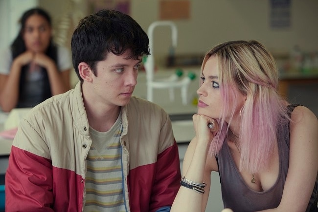 A still from a Netflix show features two teenagers looking at each-other