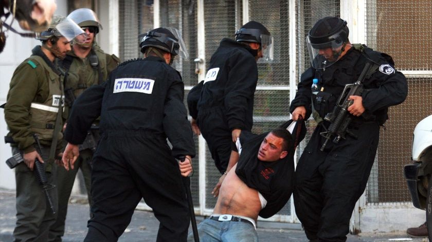 Israeli police arrest a Palestinian youth at Mount of Olives in east Jerusalem