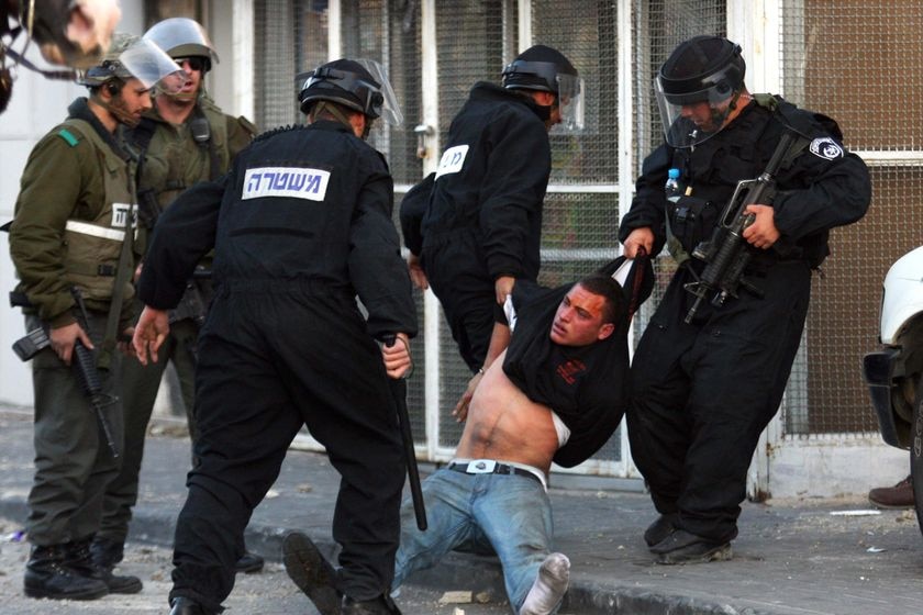 Israeli police arrest a Palestinian youth at Mount of Olives in east Jerusalem