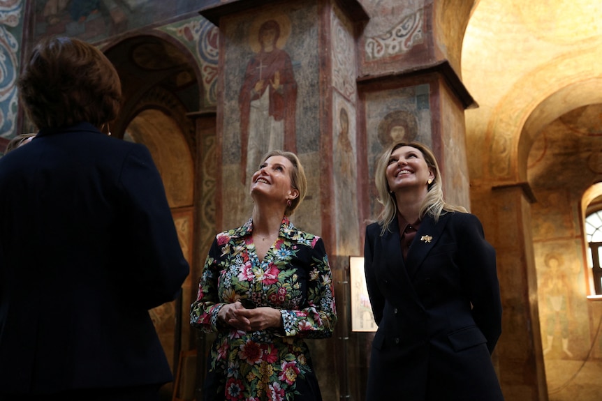 Duchess Sophie and Olena Zelenska look at the roof of a cathedral.