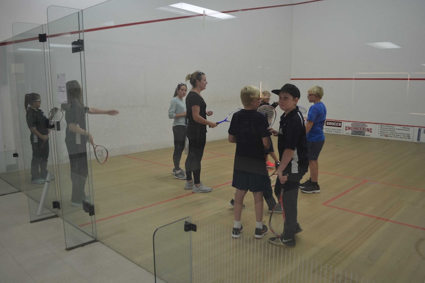 Young squash players receive coaching