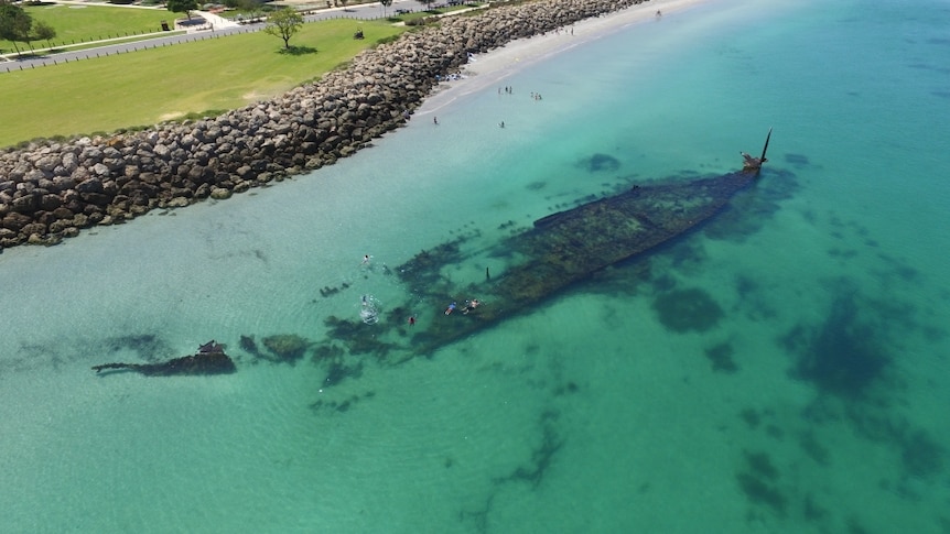 Image of shipwreck from above, very close to foreshore.