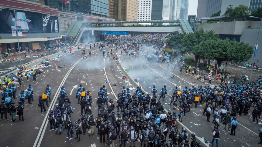 Riot police fire tear gas