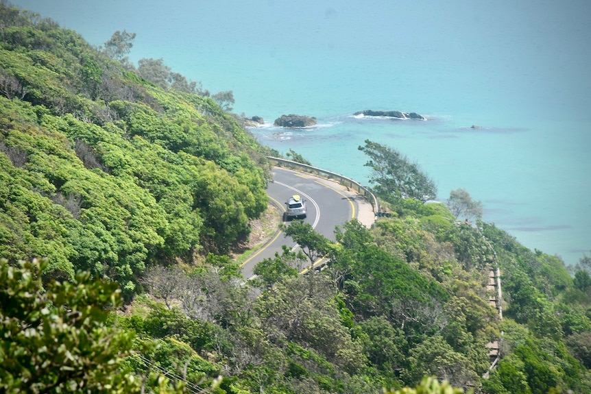 A car driving down from the lighthouse in Byron Bay.