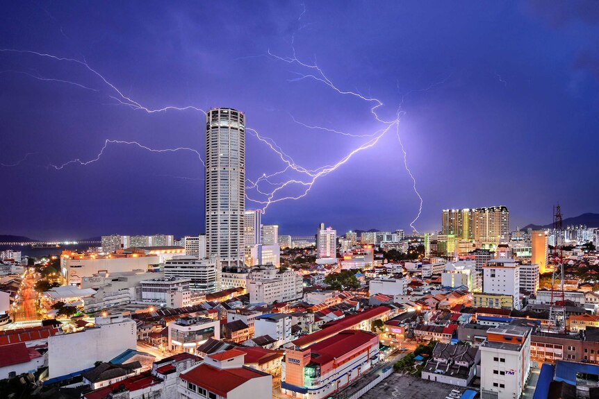 Lightning strikes behind Komtar Tower in Malaysia