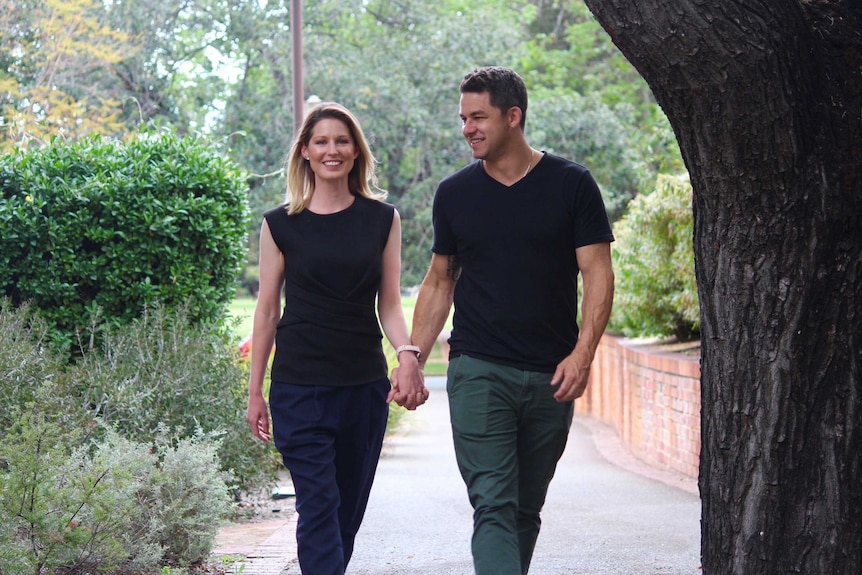 Phil Britten walking with his wife Rebecca in East Perth.