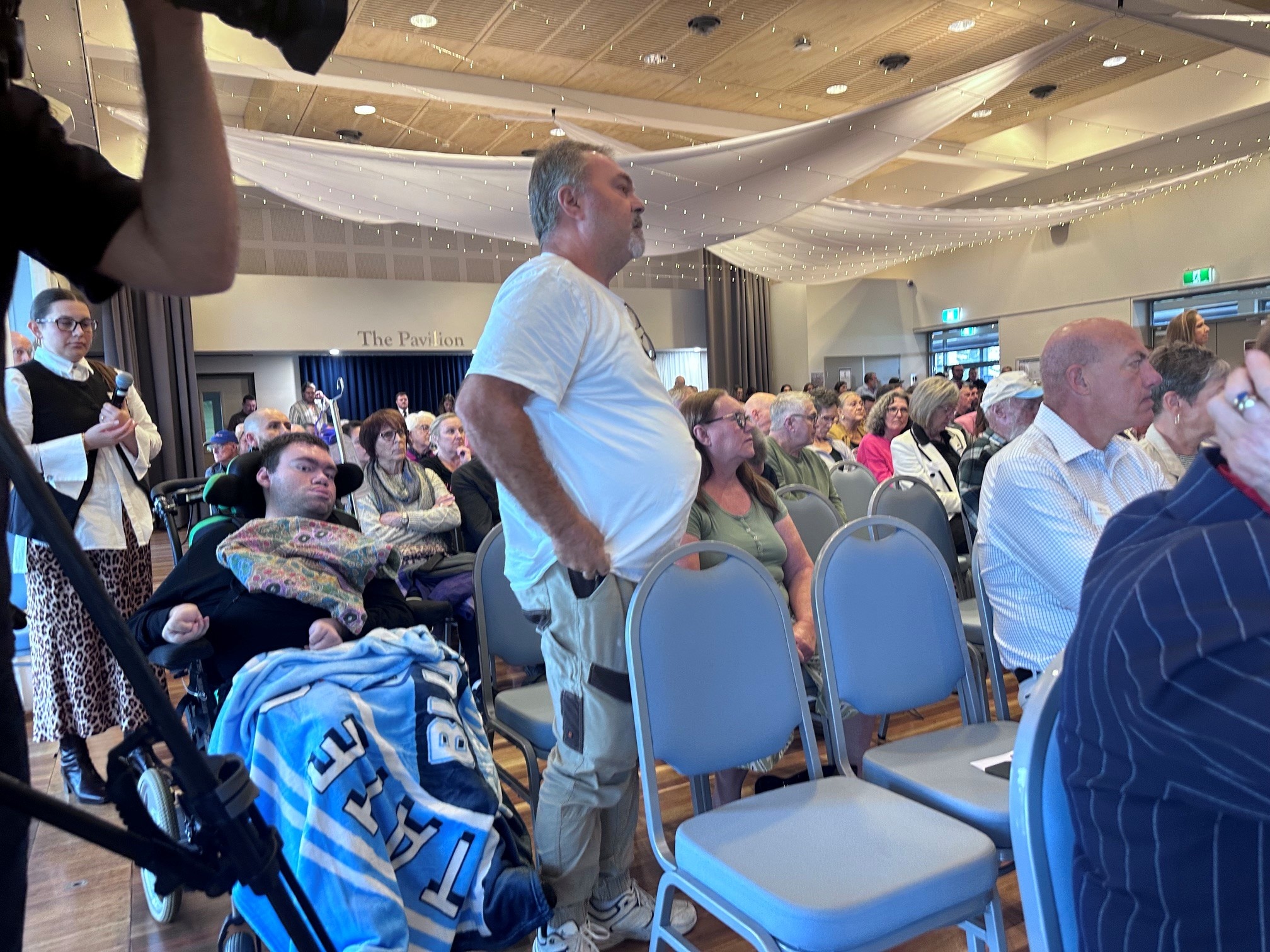 Man standing talking in a room