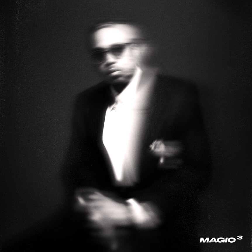 blurry photo of a man wearing a suit and sunglasses