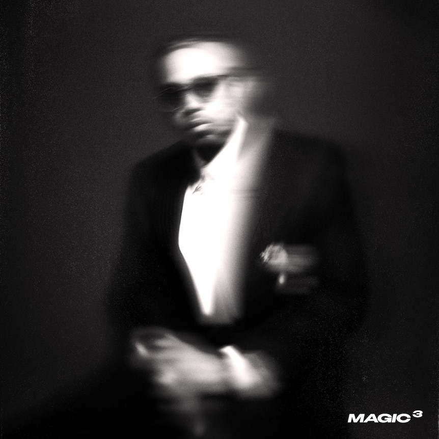 blurry photo of a man wearing a suit and sunglasses