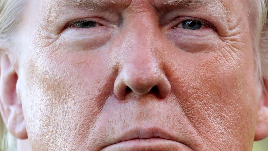 A very close-up shot of Donald Trump's face