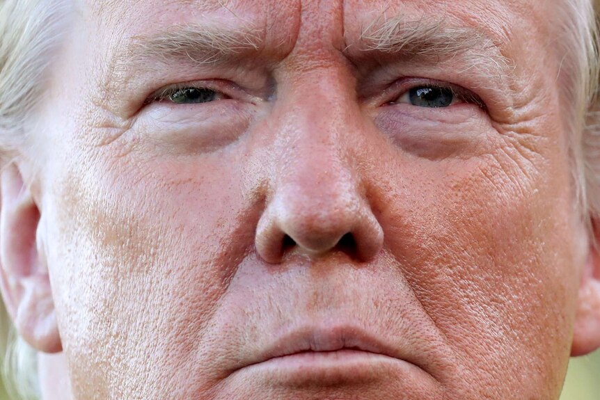 A very close-up shot of Donald Trump's face