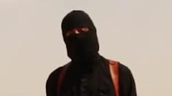 'Jihadi John' stands masked next to James Foley while holding a knife