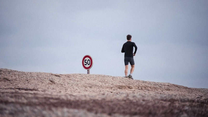 Man runs in the desert