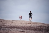 Man runs in the desert