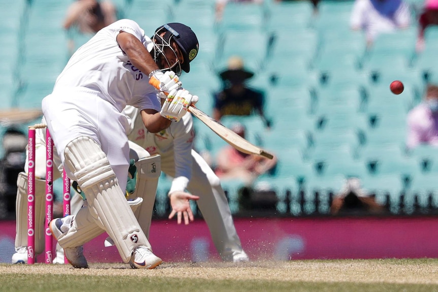 India batsman Rishabh Pant slogs on day five of the third Test at the SCG.