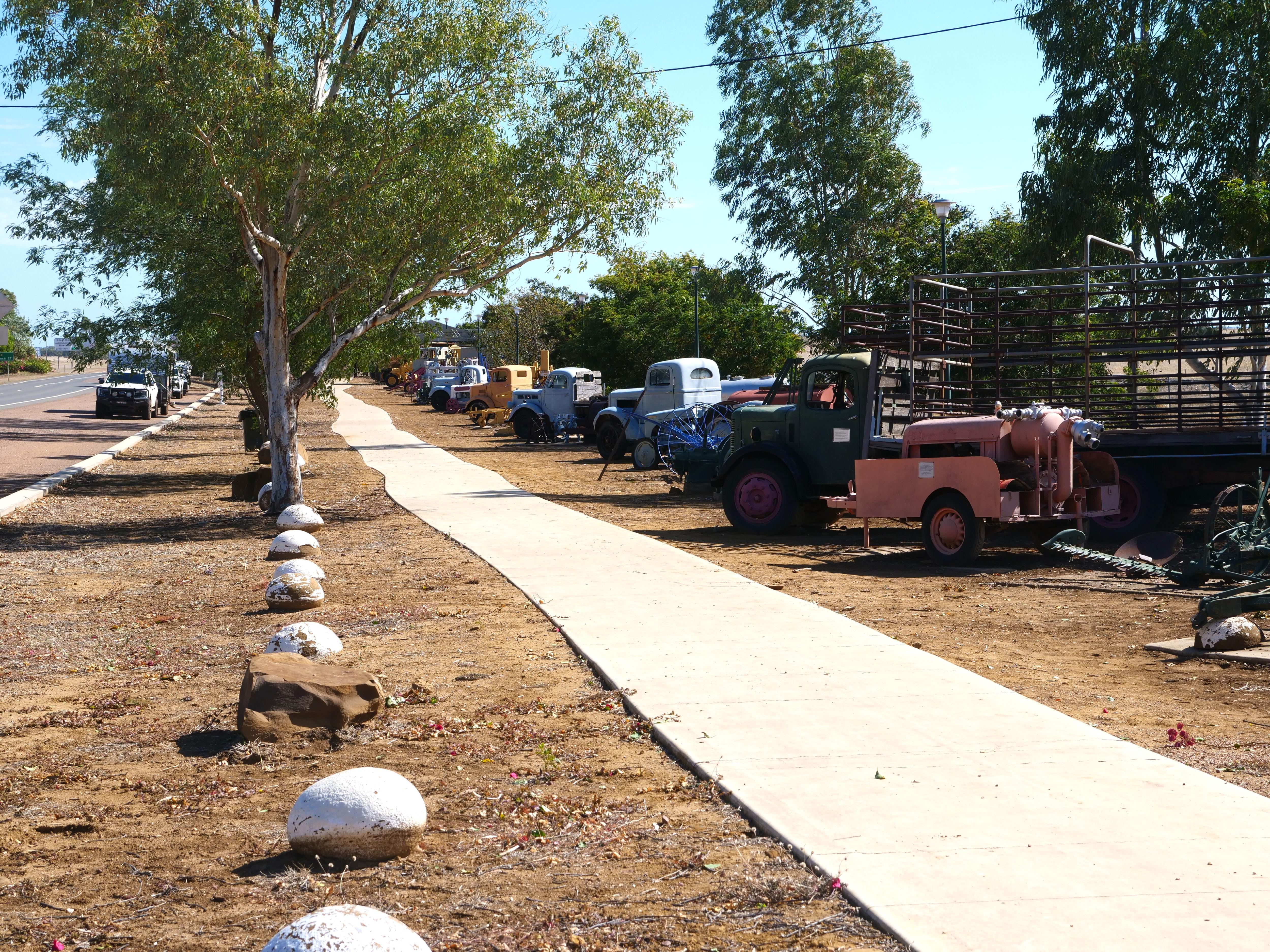 footpath with trucks lined up beside it
