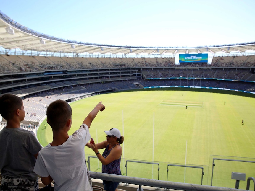 Children point out across the stadium grounds.