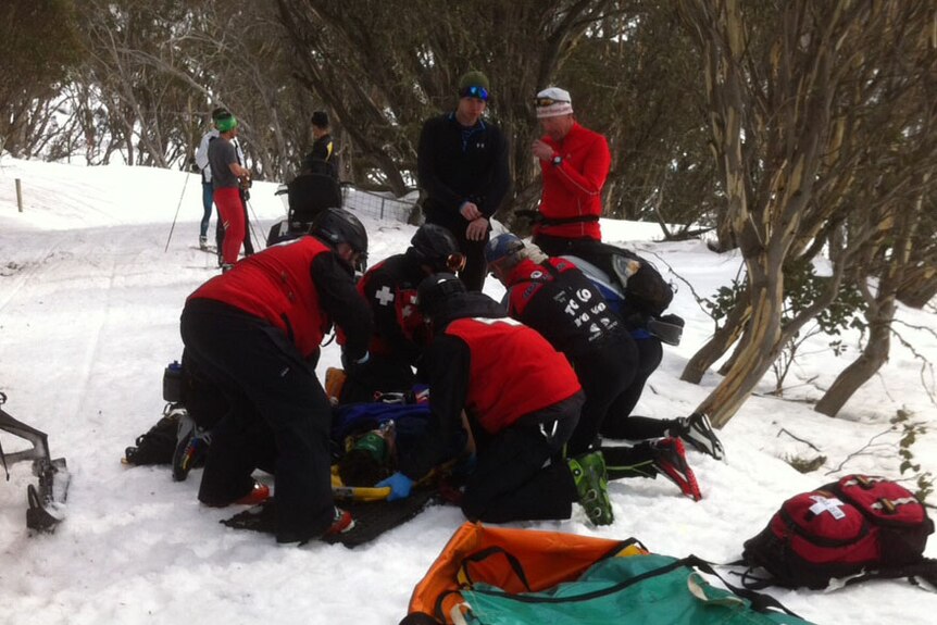 Callum Watson being treated on the snow after suffering a punctured lung.