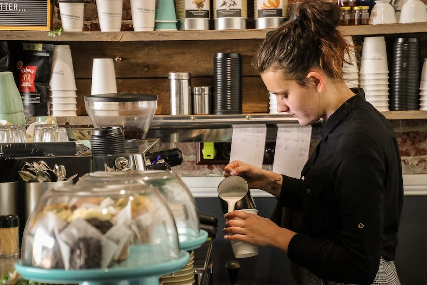 Brianna Dugan, manager at Dark Horse Espresso, pours a coffee