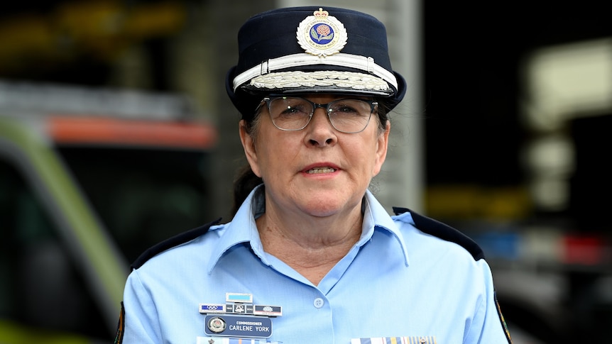a woman police officer wearing glass speaking