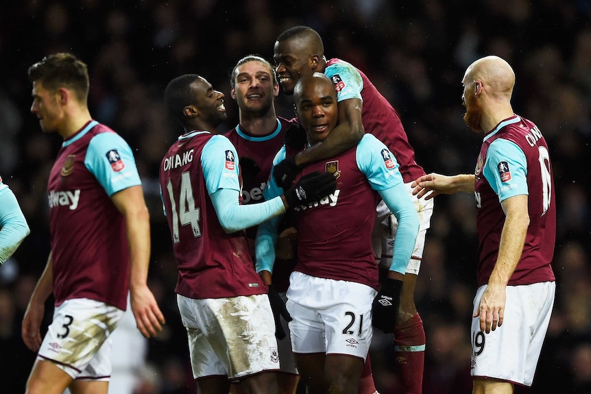 Angelo Ogbonna celebrates with West Ham United team-mates