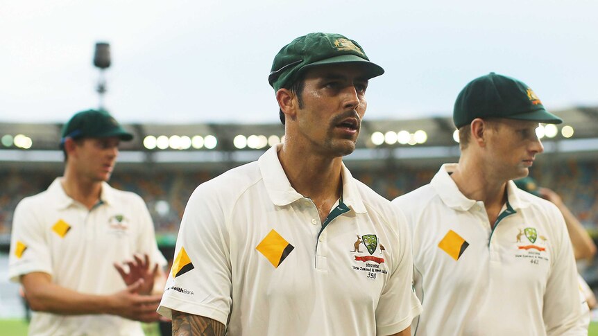 Continuing on ... Mitchell Johnson leaves the Gabba on day two of the first Test against New Zealand