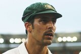 Continuing on ... Mitchell Johnson leaves the Gabba on day two of the first Test against New Zealand