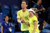 Matt Ebden and Storm Hunter shake hands after winning a mixed doubles rubber at the United Cup.
