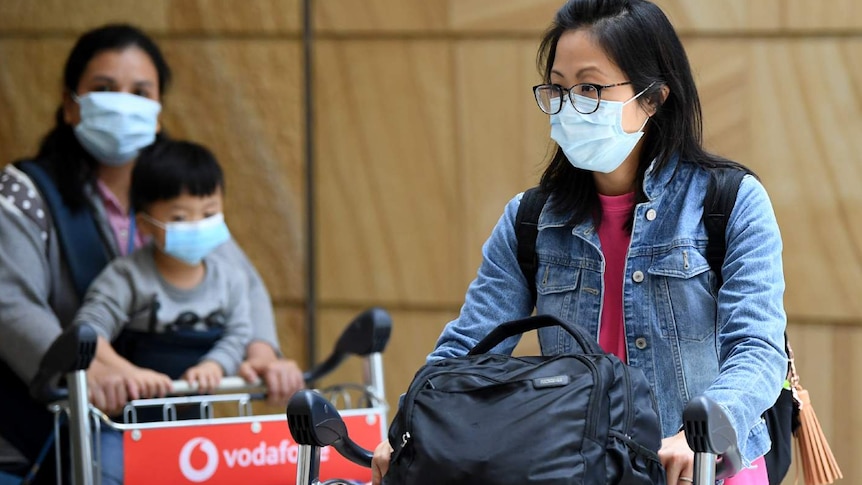 People wearing masks at airport