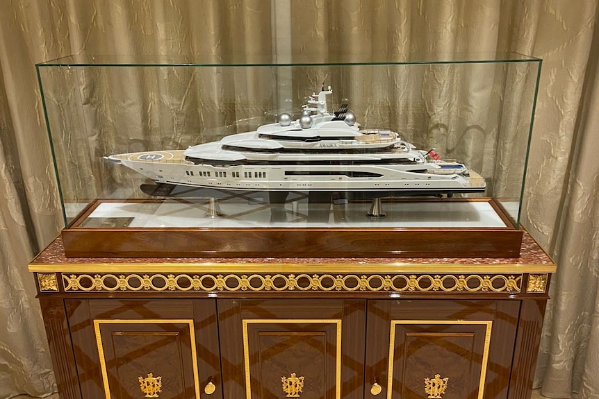 Model of Amadea superyacht displayed inside yacht
