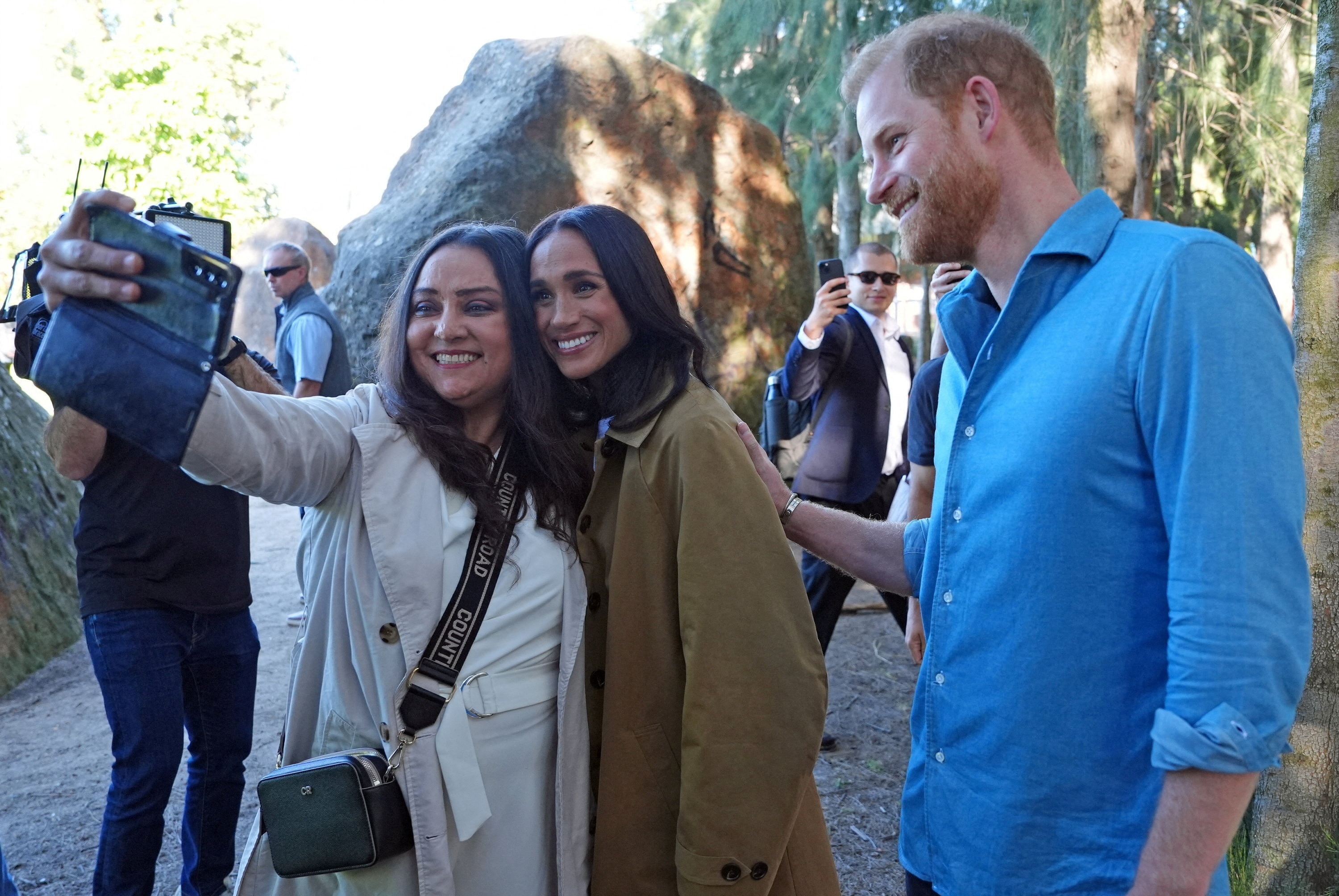 Prince Harry and Meghan, the Duke and Duchess of Sussex, pose for a selfie photo at the Scar Tree Walk in Melbourne