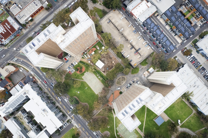 A drone photograph from above very tall public housing towers.