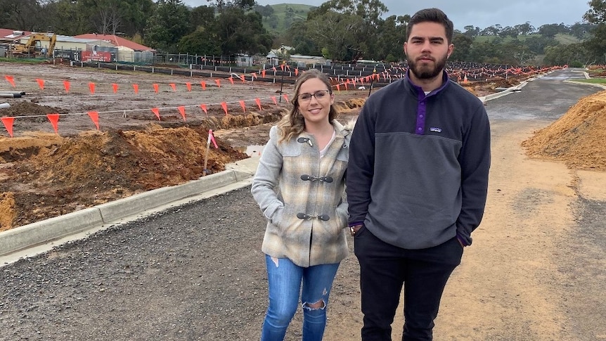 Brooke and Erik stand in front of their block in Kangarilla, South Australia.