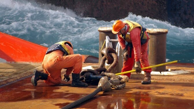 Maritime workers labouring offshore on and oil and gas rig