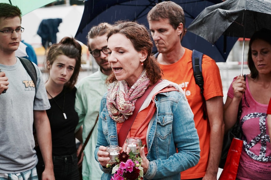 Crowds gather in Munich to mourn