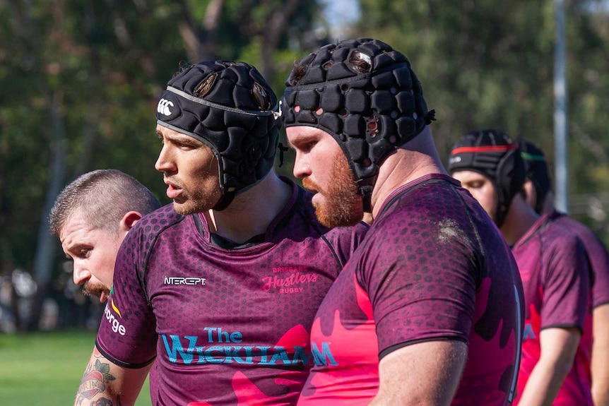 Men playing rugby union.